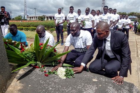 Laying Flowers at a Memorial for the 1993 Zambia Football Team Plane Crash