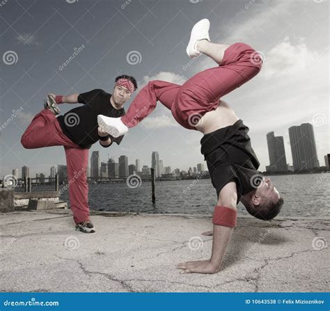 Pair of Guys Performing Acrobatic Stunts Stock Photo - Image of pair ...