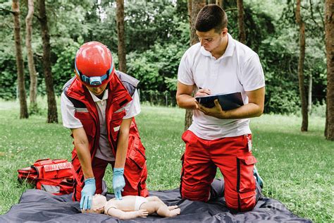 Cpr Training On Baby Dummy Photograph by Microgen Images/science Photo Library - Fine Art America