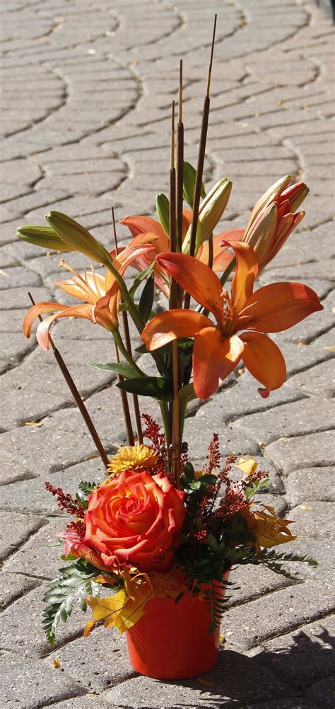 A unique Orange floral arrangement for fall! | Floral arrangements, Floral, Garden center