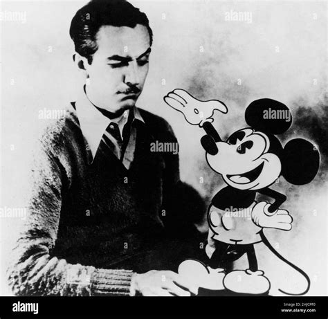 American animator Walt Disney (1901-1966) with the character of Mickey Mouse, whom he created in ...