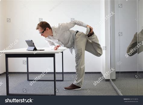 Leg Exercise During Office Work Standing Stock Photo (Edit Now) 321514019