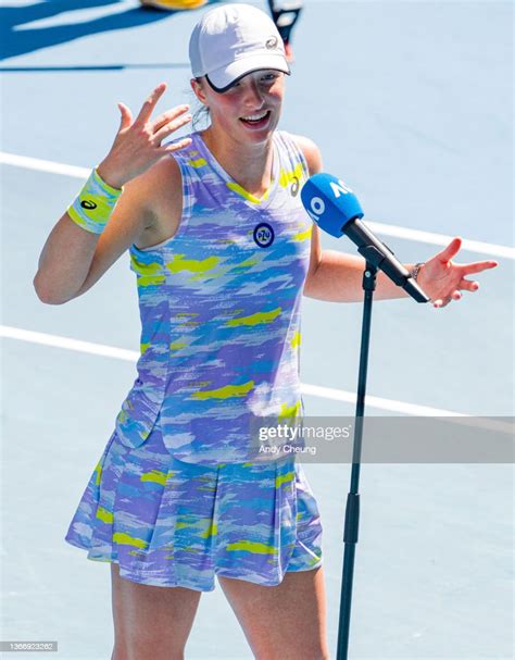 Iga Swiatek of Poland gives a court side interview after winning ...