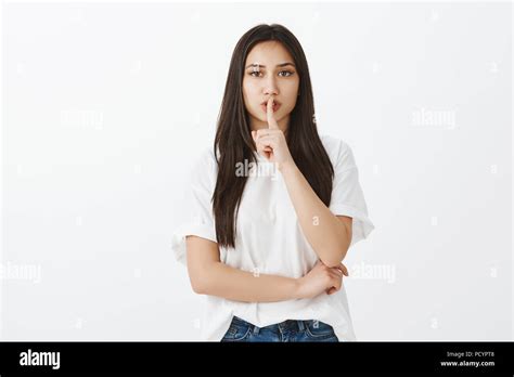 Do not make noise. Portrait of strict attractive european woman in ...