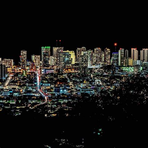 The Honolulu night skyline lights up with color. • • • • • • #honolulu ...