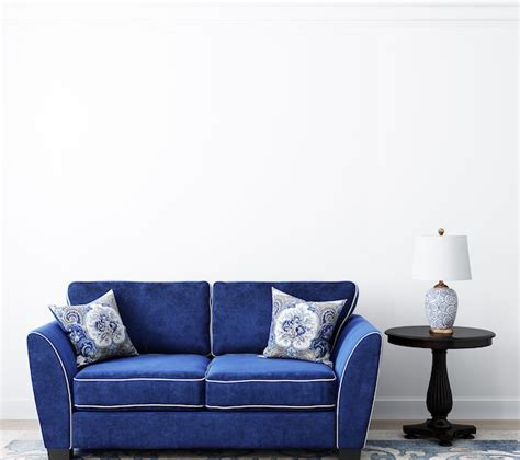 Premium Photo | White wall background in living room with dark blue sofa
