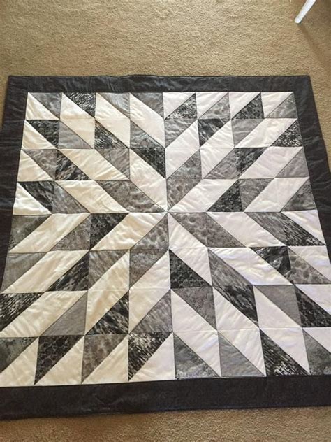 This quilt is very vibrant, and makes a great accent for the room. Black, grey, and white in a ...