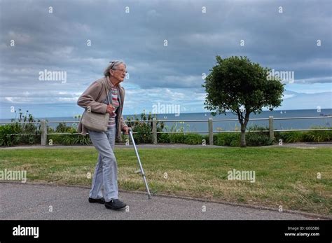 Old lady walking stick hi-res stock photography and images - Alamy