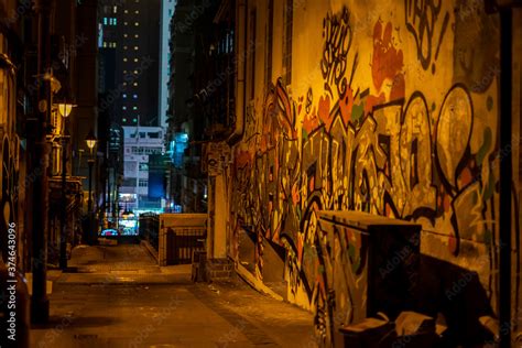 Dark alley with graffiti in Hong Kong Stock Photo | Adobe Stock