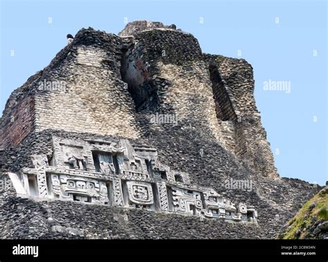 Xunantunich, Belize - May 14, 2011: Mayan carvings on the peak of the ancient El Castillo ...