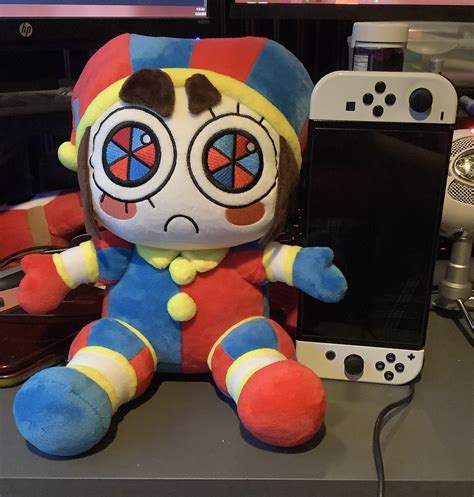 Got my pomni plush today she’s so much bigger than I expected switch oled for scale : r ...