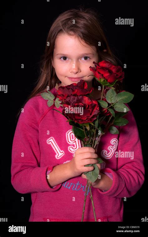 little girl with red roses Stock Photo - Alamy