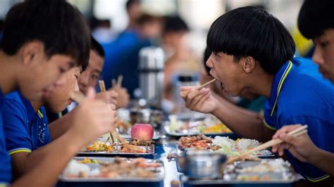 China's school headmasters ordered to eat with pupils amid food safety ...