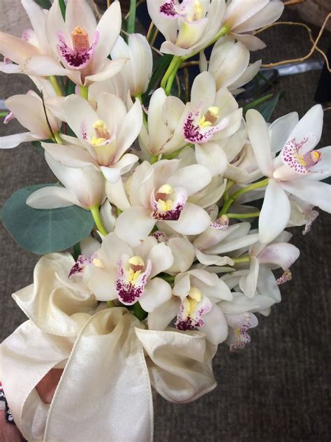 Cymbidium Orchid Bridal Bouquet | Orchid bridal bouquets, Flower delivery, Fresh flower delivery