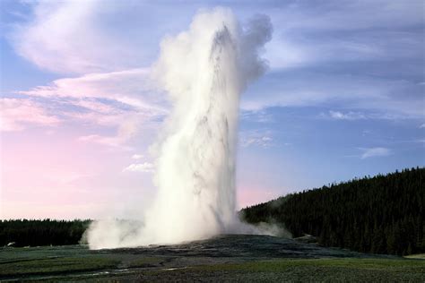 Old Faithful Geyser In The Evening by Sunchan