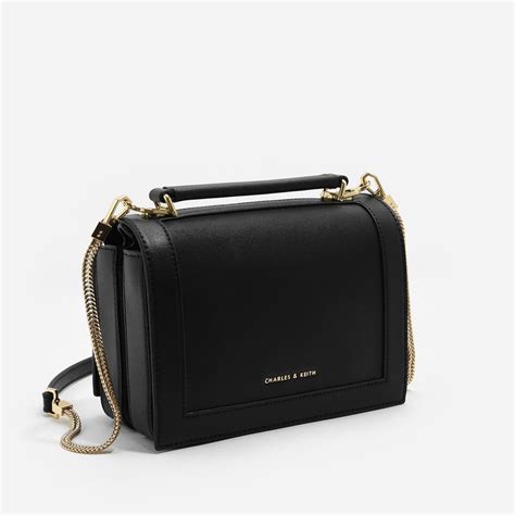 Black Front Flap Top Handle Sling Bag | CHARLES & KEITH | Sling bag ...