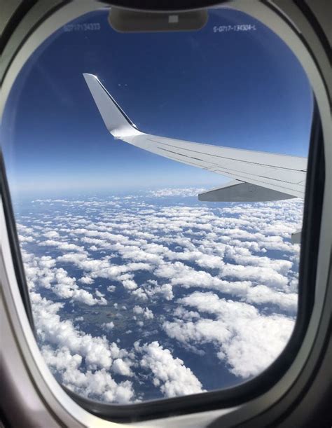 view of the clouds from plane window on a sunny day🌤 #travel #clouds | Airplane view, Plane ...