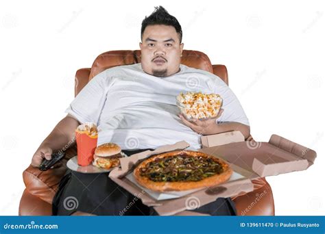 Overweight Man Eating Junk Foods on the Sofa Stock Photo - Image of burger, hungry: 139611470