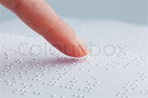 Fingers and Braille. Blind people read ... | Stock image | Colourbox