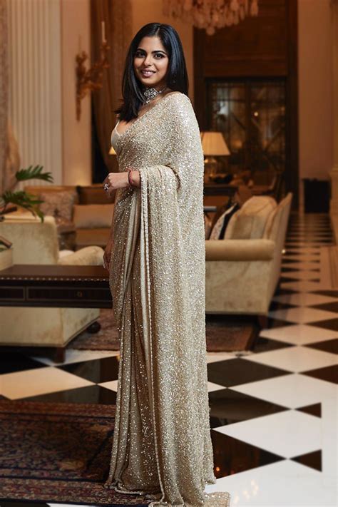 Isha Ambani wears a sequinned gold cocktail Sabyasachi sari at Armaan ...