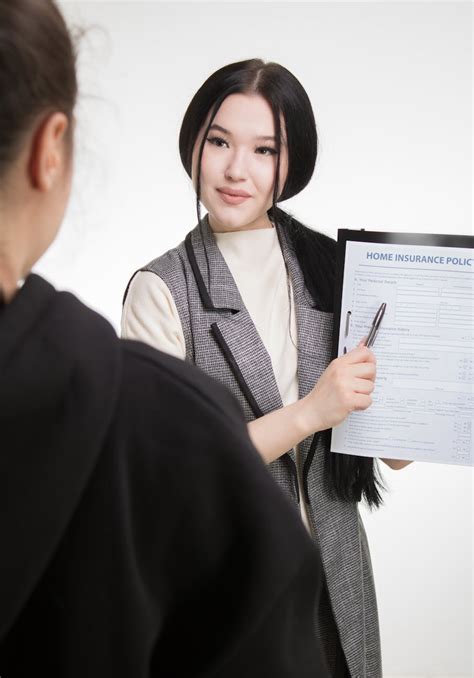 Woman in Black Blazer Holding White Printer Paper · Free Stock Photo