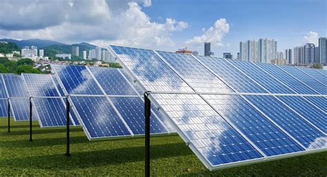 Premium Photo | Solar panels with modern city