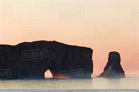 Colorful sunrise at Perce Rock, Quebec - Stock Photo - Dissolve