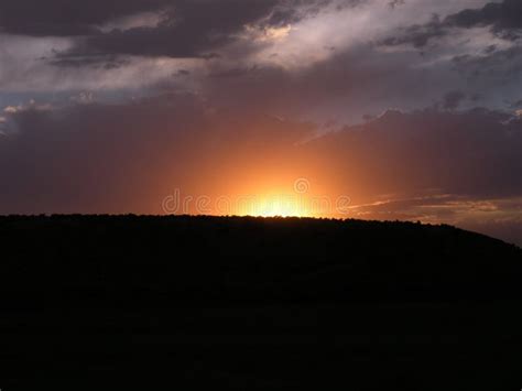 Beautiful Calm Sunset Over the Silhouette of a Hill Stock Image - Image ...