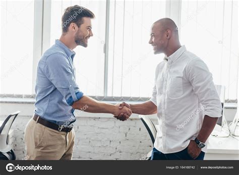 Businessmen shaking hands — Stock Photo © DimaBaranow #164168742