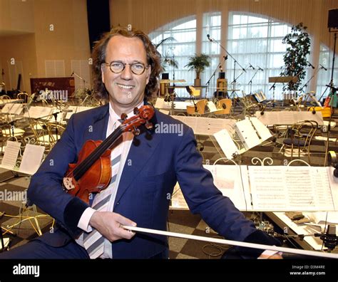 (dpa) - Dutch star violinist Andre Rieu holds a violin while standing ...