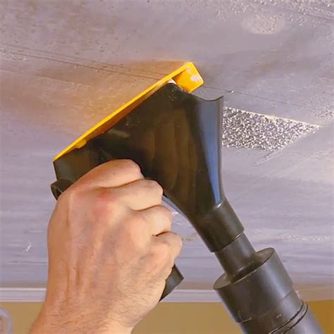 Popeeze: Popcorn ceiling scraper tool with vacuum attachment