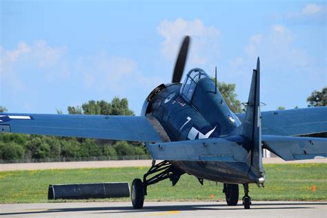 an airplane is sitting on the tarmac with its wheels down and it's propeller still attached