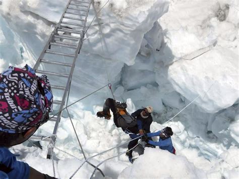 On Everest, climbers pay to take risks while Sherpas take risks to get paid