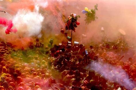 Hindu devotees throw colored powder while celebrating 'Holi,' the ...