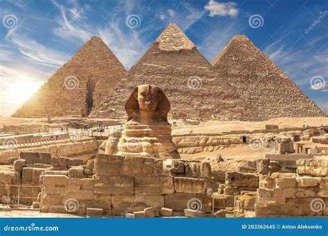 The Sphinx and the Great Pyramids of Giza Near the Ruins of a Temple in Giza, Egypt Stock Image ...