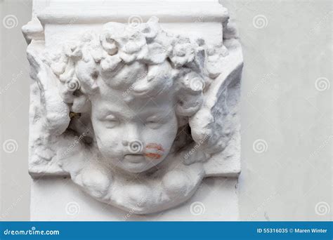 Cherub on a Building with a Lipstick Kiss on His Cheek Stock Image - Image of child, carving ...