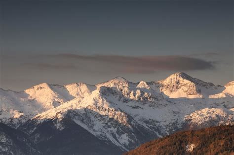 Premium Photo | Mountain peaks in winter at sunrise