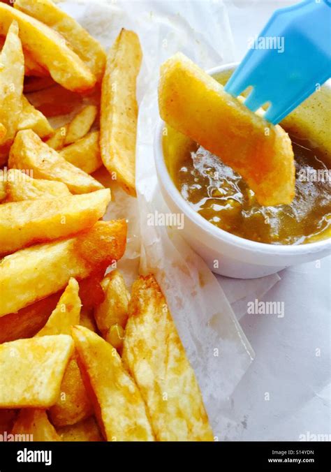 Chips and curry sauce Stock Photo - Alamy