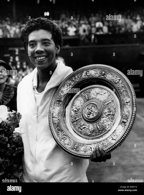 Tennis pro Althea Gibson shows off Wimbledon trophy Stock Photo - Alamy