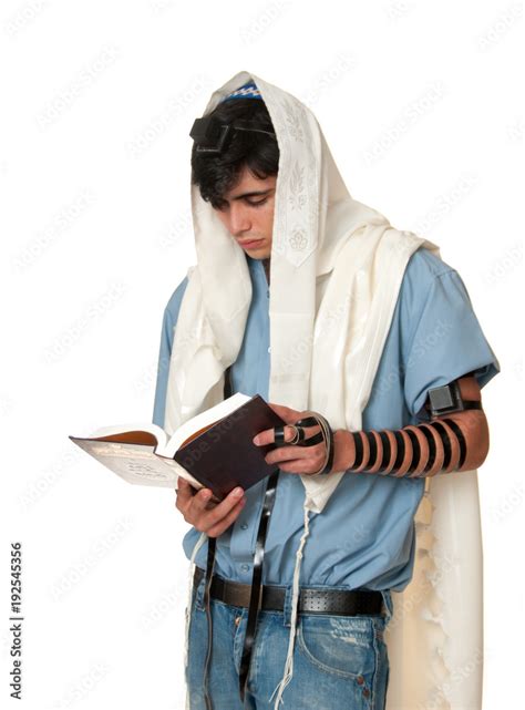 young jewish man prays wearing tallit and tefillin Stock Photo | Adobe Stock