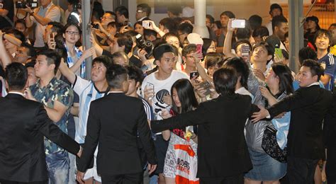 Lionel Messi & Co arrive to take on Hong Kong - but only half the 40,000 tickets have been sold ...