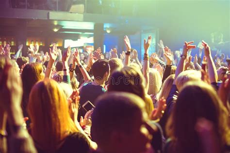 The Audience Watching the Concert on Stage. Stock Image - Image of beam, crowd: 106630623