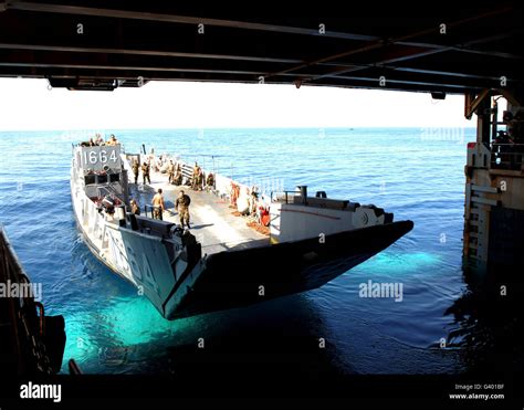 A landing craft utility departs the amphibious dock landing ship USS ...