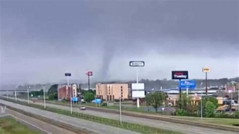 Tornado tears through Arkansas city, prompting curfew and National Guard response