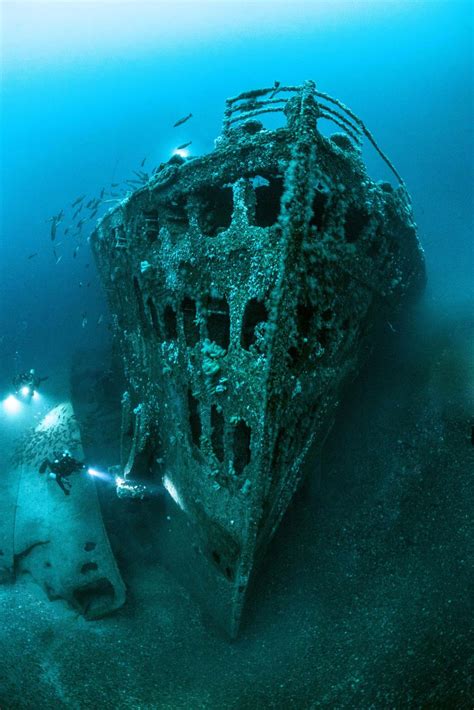 Stunning underwater snaps show wreckage of huge ship sunk by six ...