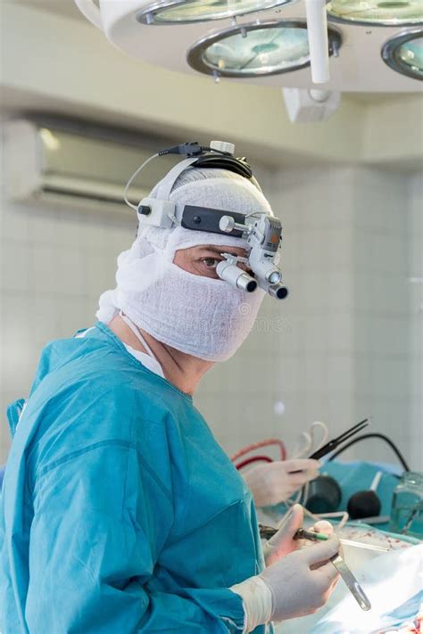 The Surgeon in the Operating Room Stock Photo - Image of surgeon, room: 61934470