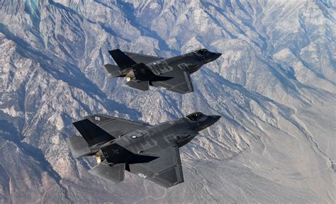 Two F-35C Lightning II aircraft fly in formation for a pho… | Flickr
