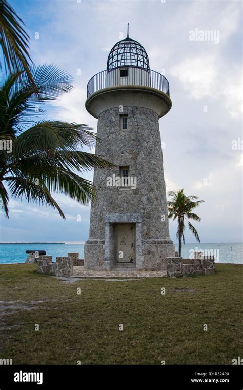 Boca Chita Key Lighthouse with palm trees Stock Photo - Alamy