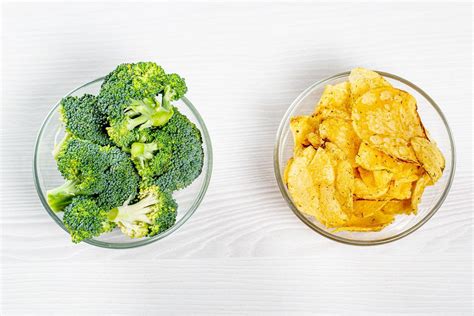 The concept of healthy eating and unhealthy eating is one bowl of broccoli and the other one ...