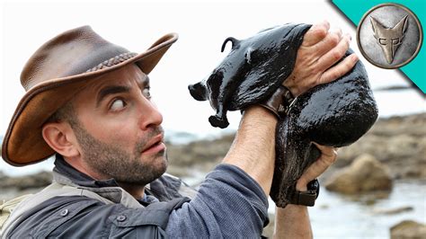 Wilderness Expert Coyote Peterson Picks Up a Giant Black Slug That's the Size of a Small Dog